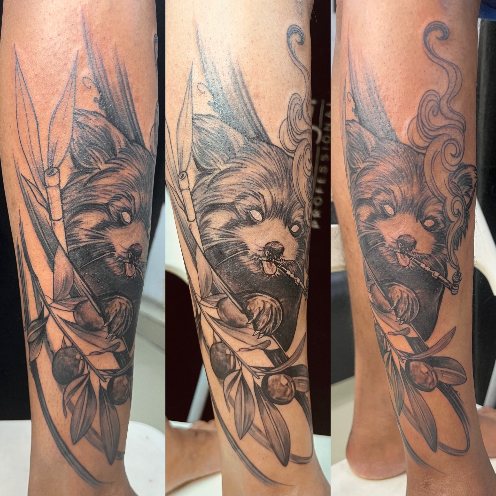 Raccoon dog tattoo on leg